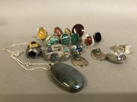 A collection of silver stone set jewellery including a pendant, earrings and a brooch, variously set