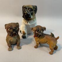 A cold painted lead figure of a pug with a frog on it's back and another with a fly on it's nose,