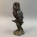 A filled white metal (tests as silver) model of a Barn Owl by Country Artists, modelled on a branch,