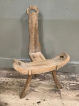 A carved beech spinning chair on splayed legs