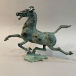 A bronze Han dynasty style model of the Flying Horse of Kangxai, 16cm high, with damages