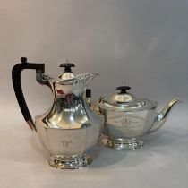A George V silver teapot and hot water jug Sheffield 1938 for Frank Cobb and Co Ltd both of oval