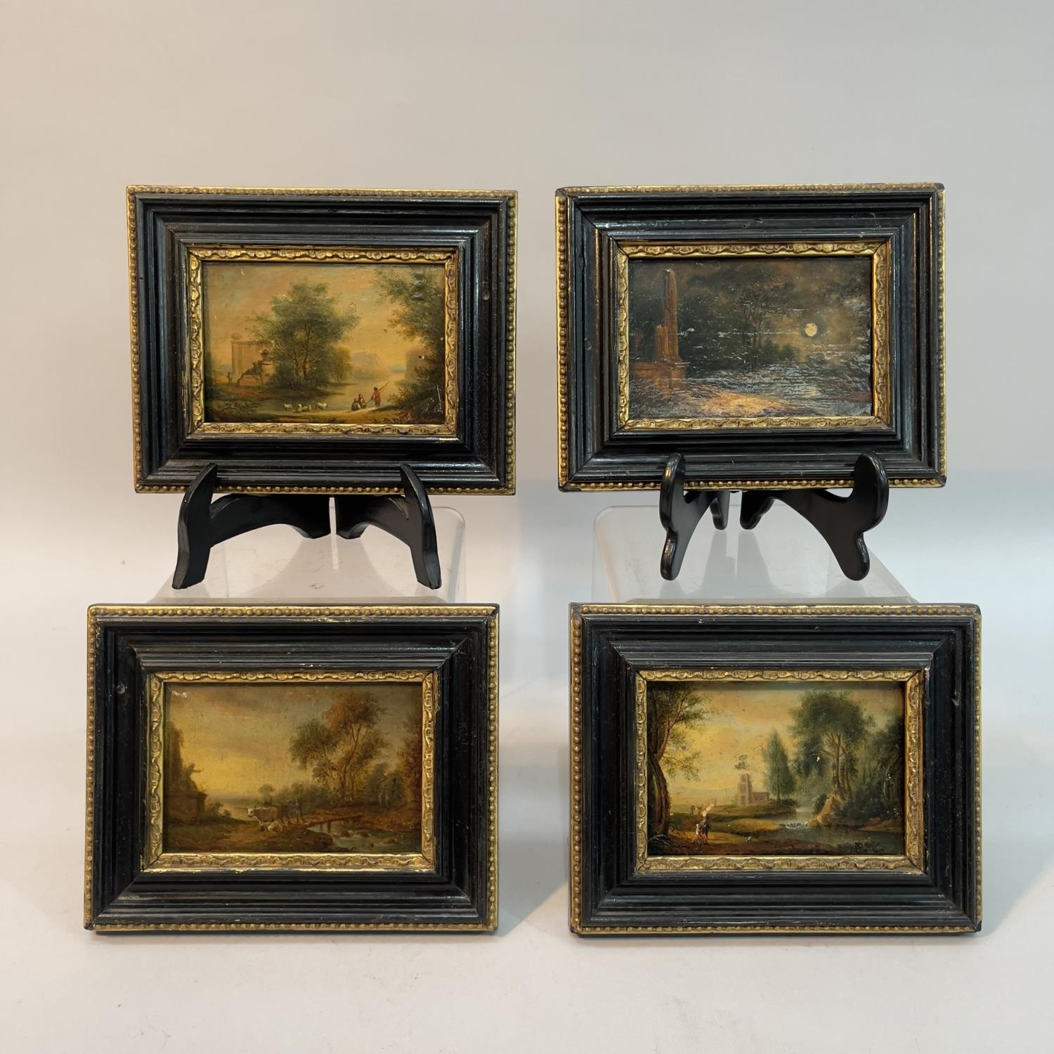 A set of four miniature landscapes with figures, painted on paper laid on to panel, unsigned, 10.5cm