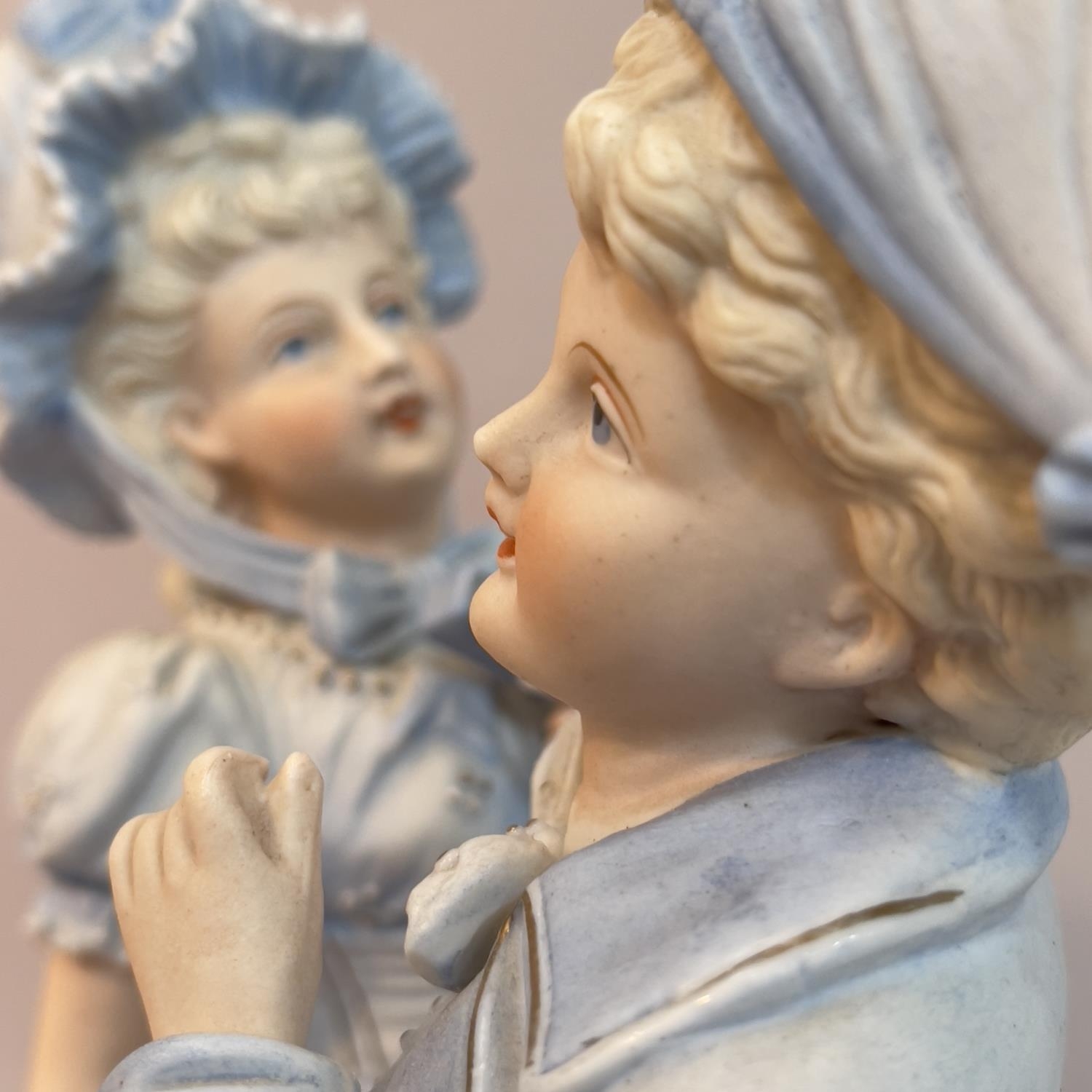 A pair of late 19th century continental pale blue figures of children dressed as a beau and - Bild 2 aus 2