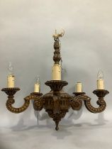 An early to mid 20th Century polished wood five light pendant light fitting with faux bois finish,