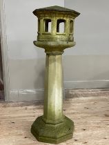 A cast stone garden bird house on column, 125cm high