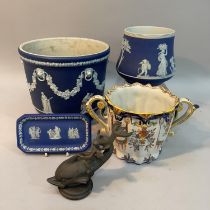 A jasperware jardiniere applied with classical figures, grape vine swags and lion masks with