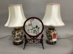 A pair of modern baluster lamps enamelled with flowers and gilt on a crackle glaze ground on