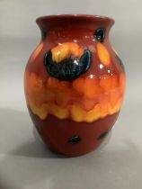 A Poole pottery Volcano vase, of bulbous form with orange, red and a blue glaze, having a duck egg