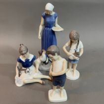 A Bing & Grondahl figure of a woman feeding chickens, no.2220 24cm high, another of a girl with