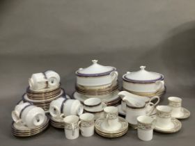 A Paragon lilac and gilt dinner service for eight comprising dinner plates, soup bowls, cups and