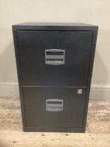A black two drawer metal filing cabinet