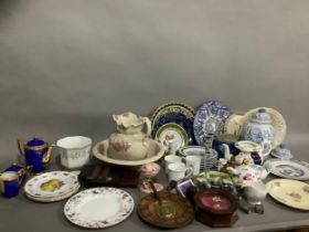 A large quantity of ceramics including toilet jug and bowl, decorative plates, commemorative plates,