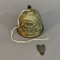A 20th Century Brass Sanctuary Bell string holder and a Chinese spade coin