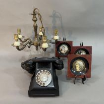 A brass five armed electrolier with ceiling chain and a bakelite telephone and three reproduction