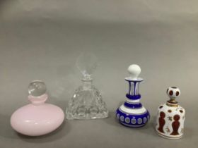 Several 19th/20th century glass scent bottles, including a cranberry and white overlay