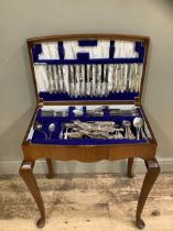 A walnut table canteen containing associated sets of kings pattern EPNS cutlery