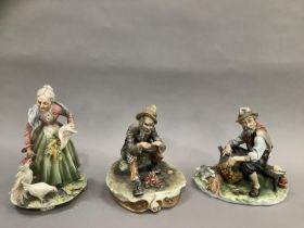 Three Capodimonte figures, a man with a fire and a man on a bench weaving a basket with a dog and