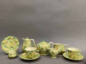 A Crown Ducal Primula patterned tea set for two comprising two cups and saucers, teapot, hot water