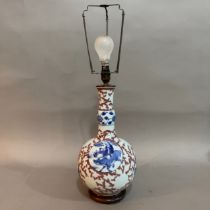 A Chinese red, blue and gourd vase converted to a lamp on carved hardwood base, the body having