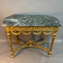 A continental marble and giltwood table, of rectagular form with semi bowed ends, having a carved