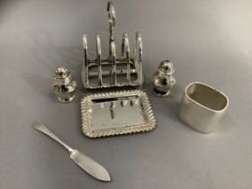 An Edward VII silver toast rack, Sheffield 1905, for James Dixon and Son Ltd, together with a