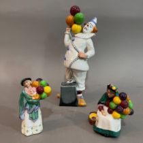 A Royal Doulton figure 'Balloon Clown' 24cm, 'The Old Balloon Seller' 8cm high, 'The Balloon Seller'