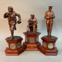 Three figures of THE BRAVE BRITISH TOMMY from the Danbury Mint, bronzed sculptures on a wooden