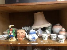 A quantity of ceramics including toby jugs, Japanese vases, lamp etc