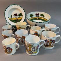 Six Dartmoor ware bowls hand painted with landscape and house together with a pedestal bowl on foot,