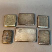 Five early to mid 20th century silver cigarette cases together with one silver plated cigarette