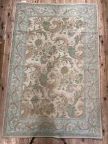 A turquoise Laura Ashley rug, 175cm x 115cm