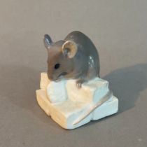 A Royal Copenhagen figure of a mouse on sugar, no.510, 4cm high