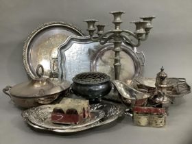 A collection of EPNS comprising circular tray, a twin handled tray, a small salver, two dishes