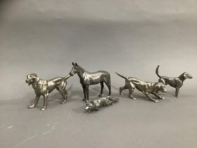 A silver plated hunting group of horse, a small hunting dog, two further hunting dogs and a fox