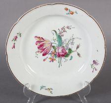 AN 18TH CENTURY HOCHST PORCELAIN PLATE, polychrome painted with tulip, peony and other blossom,