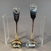 TWO VICTORIAN SILVER FIDDLE AND SHELL PATTERN MUSTARD SPOONS, one engraved with crest 'Nobilis Ira',