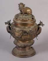 A CHINESE BRONZE KORO, Qing, the domed and pierced cover surmounted with a dog of fo, the body