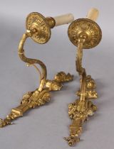 A PAIR OF GILT METAL WALL SCONES CAST with the bust of an emperor and empress above a floral swagged