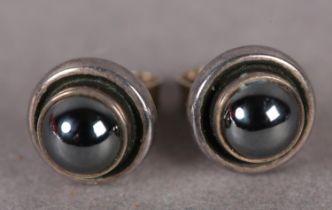 GEORG JENSEN SILVER EAR STUDS each collet set to the centre with a circular cabochon in hematite,