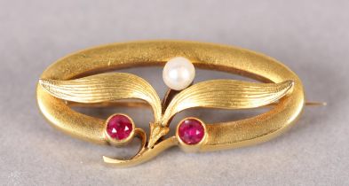 A LATE 19TH/EARLY 20TH CENTURY RUBY AND PEARL BROOCH in 14ct gold, the circular faceted rubies and