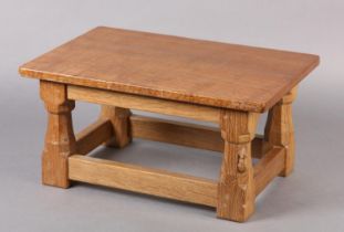 THOMPSON OF KILBURN 'MOUSEMAN' An oak footstool, rectangular, on turned and square framing carved in