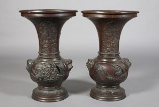 A PAIR OF JAPANESE BRONZE VASES, MEIJI PERIOD, of baluster outline, the neck cast with opposing
