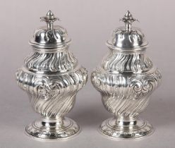 A PAIR OF GEORGE II SILVER TEA CADDIES, London 1757, for Alex Johnson, of writhen baluster form, the