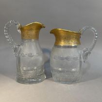 TWO MOSER CRYSTAL 'SPLENDID GOLD' WATER JUGS, early to mid 20th century, one with indistinct