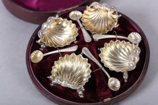 A SET OF FOUR VICTORIAN SILVER GILT SHELL-SHAPE SALTS, London 1877 for Robert Hennell IV, each on