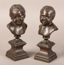 A PAIR OF LATE 19TH CENTURY BRONZE BUSTS OF INFANTS, after Messerschmidt (1736-1783), one