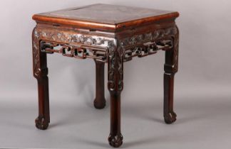 A CHINESE HARDWOOD AND MARBLE INSET URN STAND, of square outline, the apron and upper leg carved