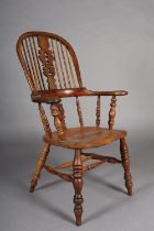 A MID 19TH CENTURY YEW-WOOD WINDSOR HIGH BACK ARMCHAIR, having a pierced and scrolled profile