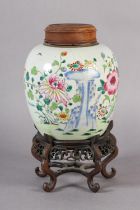 AN 18TH CENTURY CHINESE FAMILLE ROSE GINGER JAR, the ovoid body painted with chrysanthemum and peony